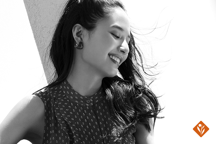 Black and white image of a smiling woman