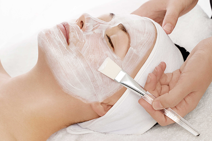 woman getting facial treatment
